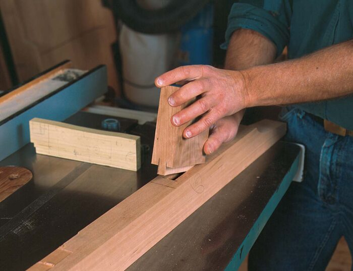 After cutting the scrap to the marked lines, the author tests the fit in the mortise.