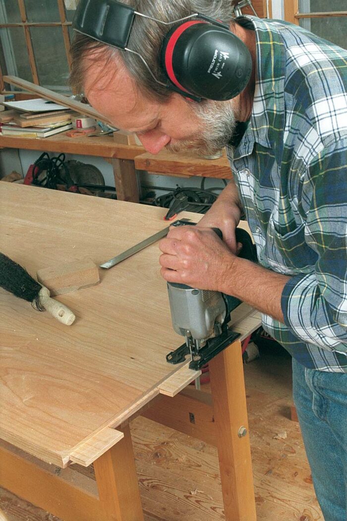A jigsaw quickly cuts the long, single breadboard tenon into a tongue-and-tenon sequence that will fit into mirror-image mortises already cut in the end cap.