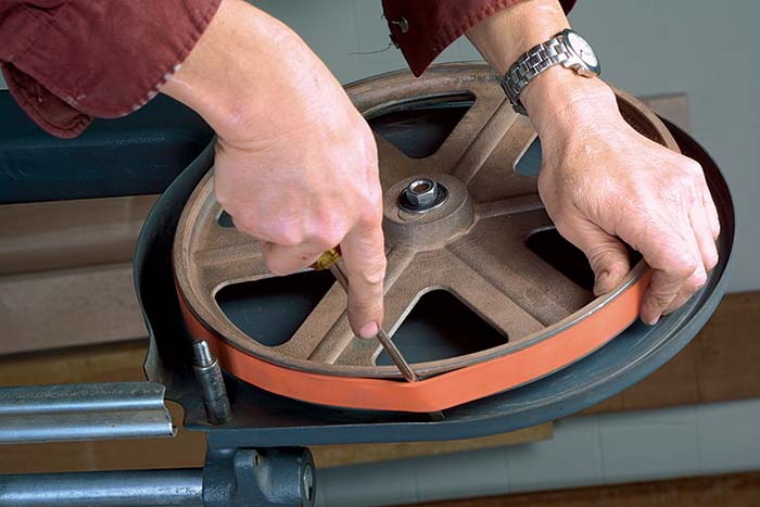 then rotate the wheel while holding the screwdriver in one spot