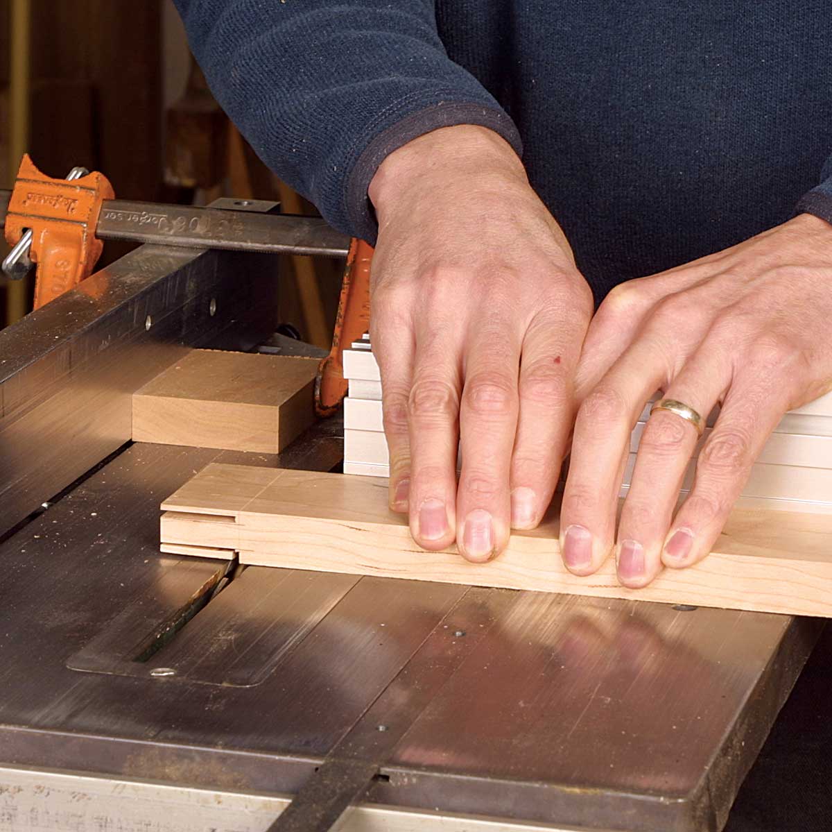 Use the miter gauge and a stop block. For consistent tenon shoulders, clamp the stop block to the rip fence and make the shoulder cuts using a miter gauge.