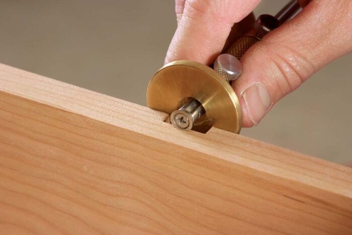 A dado or groove that’s too shallow can be deepened by establishing the new depth on each end with a marking gauge