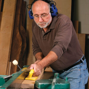 a man wearing hearing protectors while working