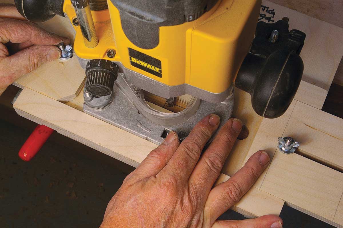 With the router bit just touching one end of the mortise, move the slide until it touches the router base and tighten the wing nut.