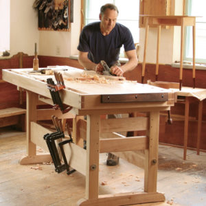 Plans for sturdy trestle base workbench for woodworking in hard maple with vise