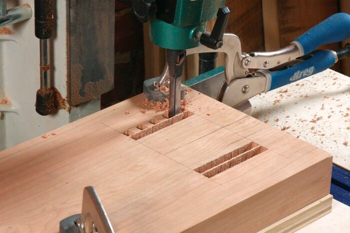 Outside rows first. Use a bit that’s less than half the mortise’s width.