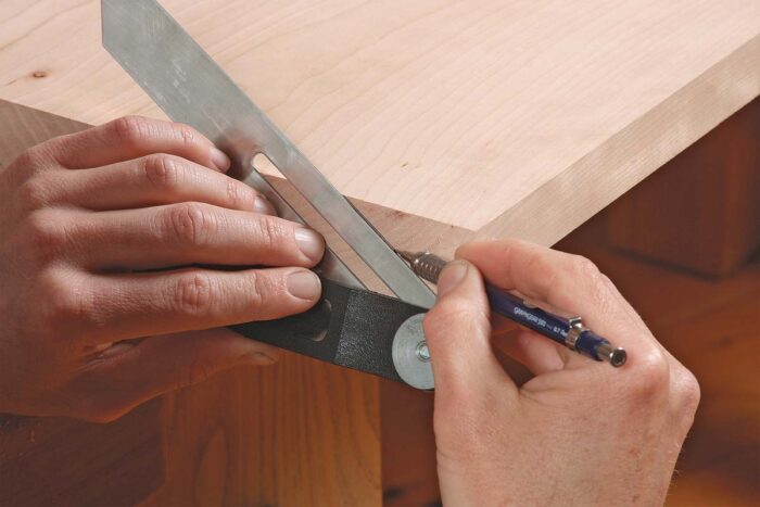 Bevel the table sides in two steps. Lay out the bevel. Set your bevel gauge to 60°. When you lay it on the angled end grain, it creates a bevel that’s 64° to the top.