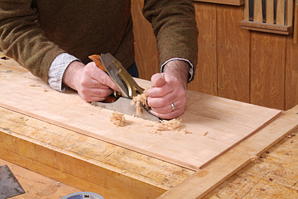 Matt Kenney surfaces the shop-sawn veneer with a jack plane. 