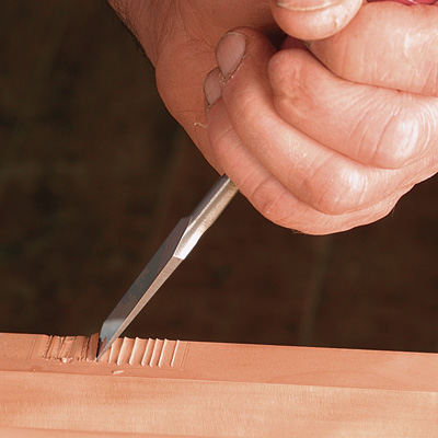 chop out waste with a chisel