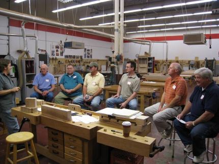The Class- Bob Van Dyke (left), Director of CVSW welcomes the class, provides an overview of whats ahead and goes over some shop best practices and ground rules.  A sample of the workbench we are to build is in the foreground.  We are not doing the cabinet shown below.