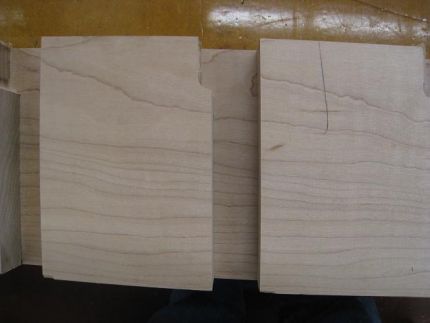 The square benchdog  holes are cut at a slight angle on the tablesaw with a dado and then the bottom is cleaned up with a router.