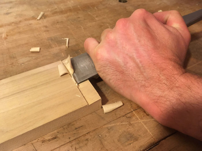 With one hand down near the cutting edge, I anchor the tool and pivot it on the reference surface, while my other hand back on the handle powers the tool forward with a slicing motion