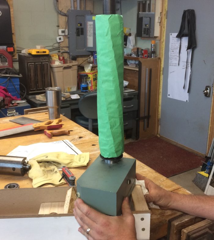 cutterhead upright wrapped in green plastic