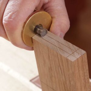 Scribe the tenon’s width. Mark 3⁄8 in. from both edges. Scribe the ends only. After you cut the cheeks, bring these marks down the tenon.