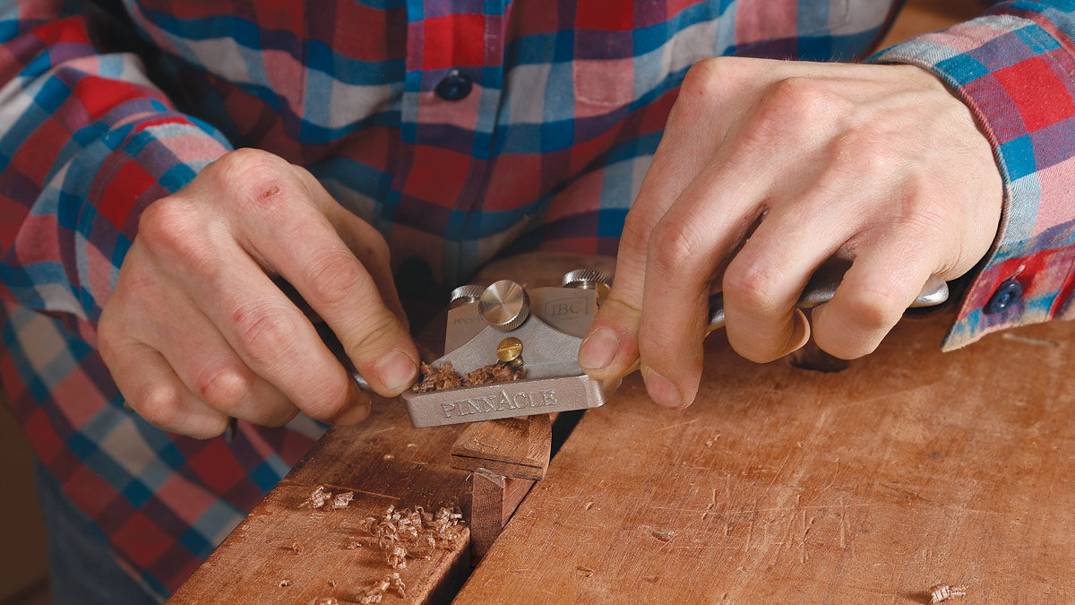 phillip morley shapes the piece with a spokeshave