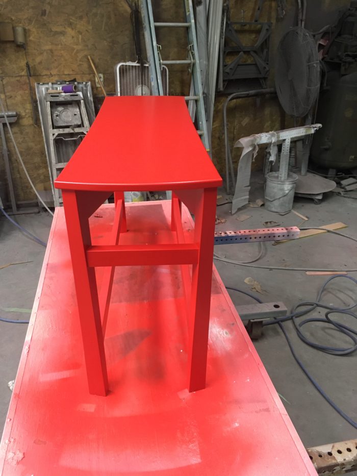 spray painting the bench red