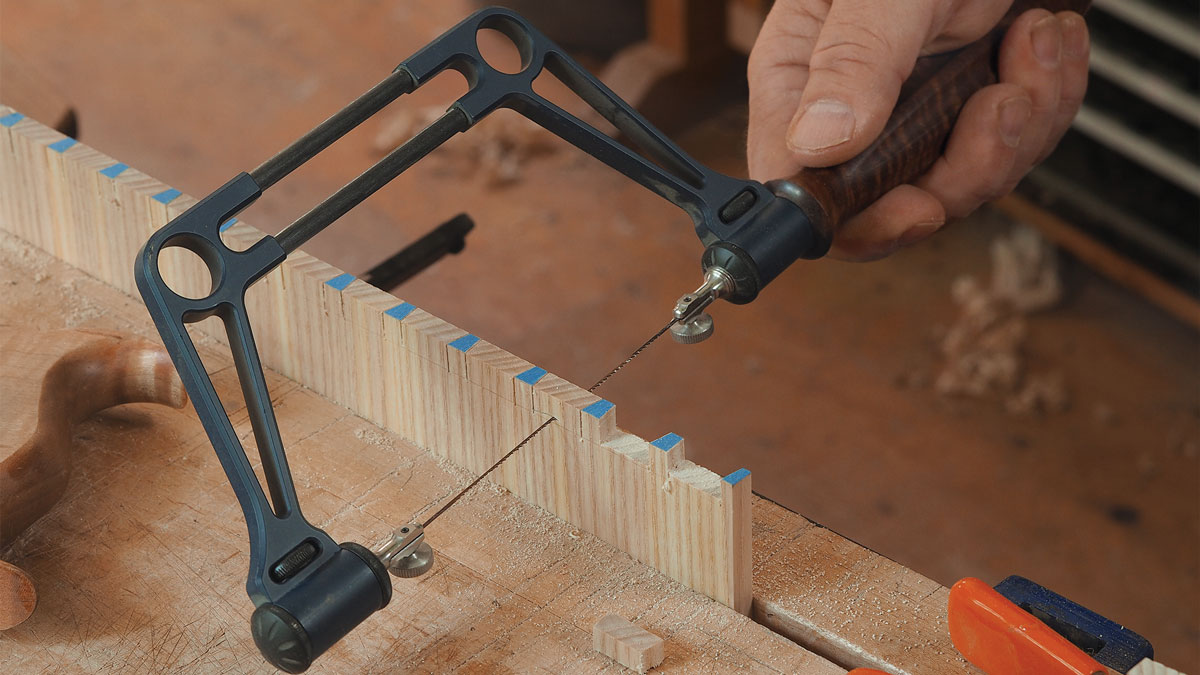 Cope out most of the waste. Use a fretsaw (or a coping saw) to remove the majority of the waste, staying just above the baseline. This makes getting down to the baseline easier and provides an opportunity to test the fit of the joint before moving on.