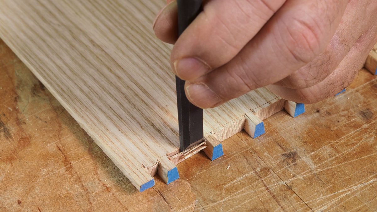 Two ways to get to the finish line. With most of the waste removed, you’ve avoided a lot of wear and tear on your chisel from heavy chopping. Now use the chisel to pare to the baseline.