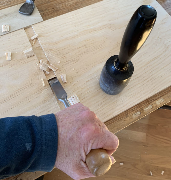 chisel bevel down to remove the remaining waste