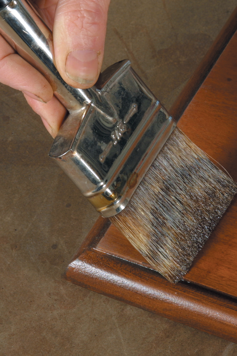 Starting about 3 in. in from the edge (B), pull the brush lightly toward the edge and lift up at the end (C).