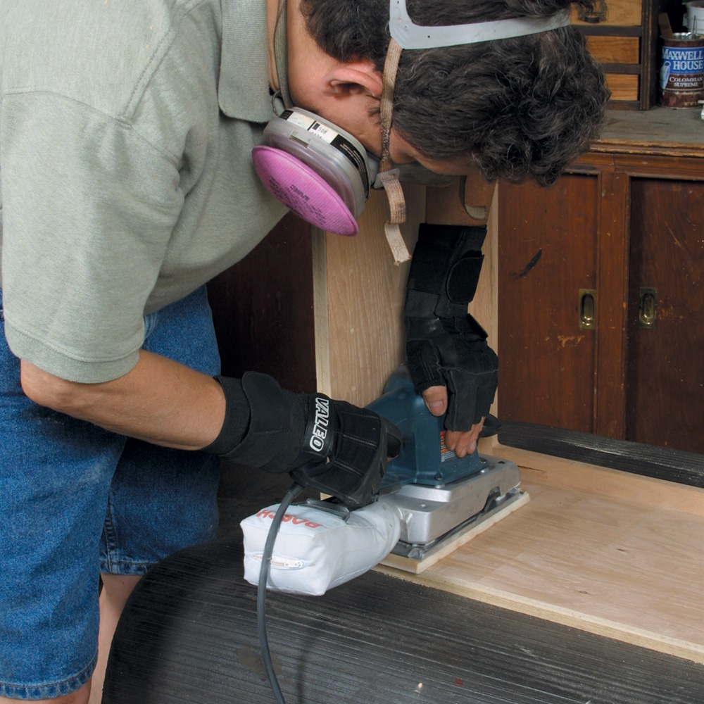 sanding a bookcase with a face frame