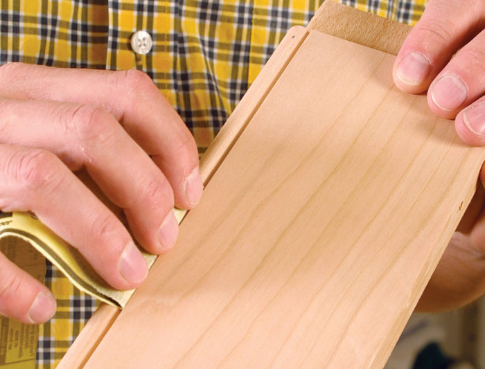 Contouring sand paper to fit curves when hand sanding