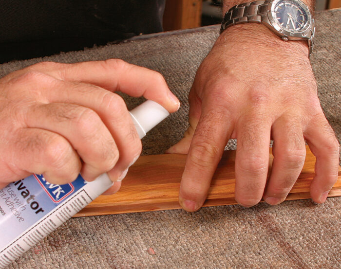 Sprayhing glue accelerator to wood surface