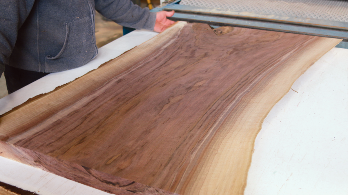 A wide-belt sander reveals the pretty colors and patterns under the roughsawn surface.