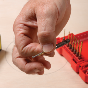 The circle-cutting jig will pivot on a nail, so find a nail and drill bit that match each other.