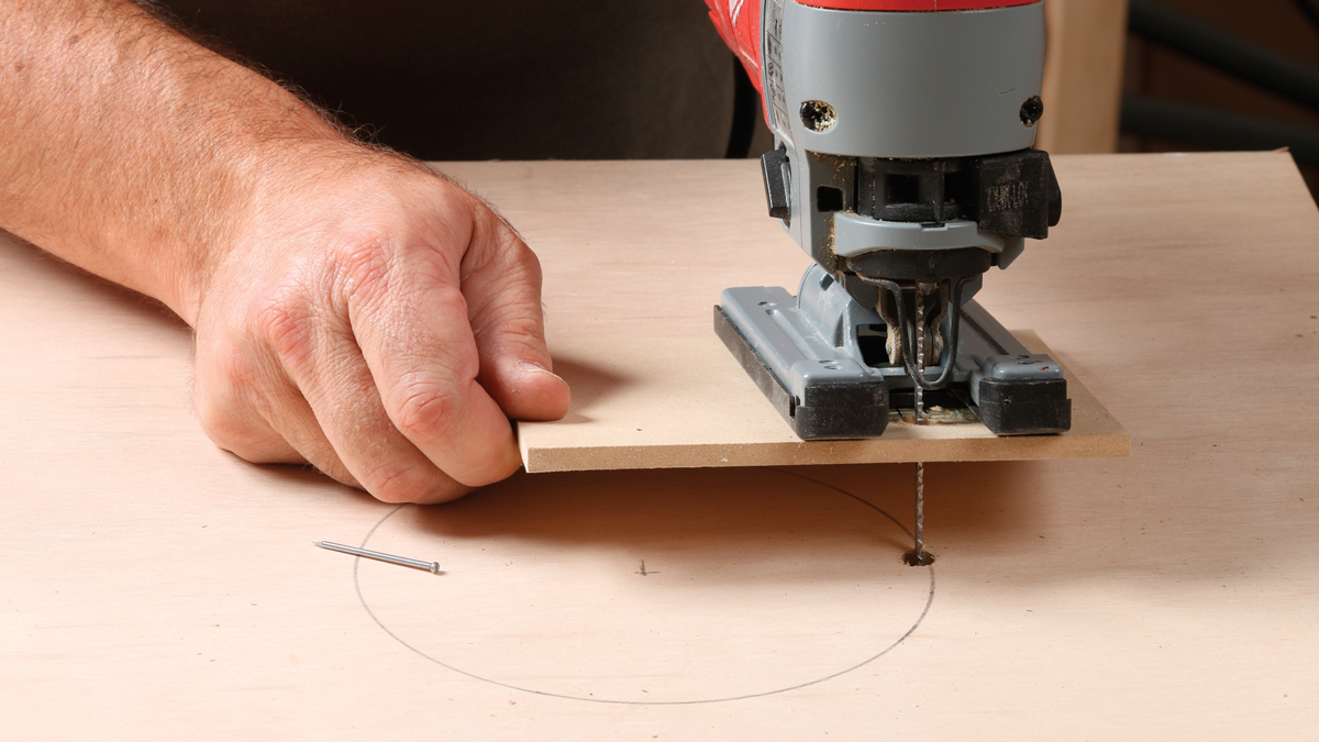 Drop the blade into the hole, press the pivot nail down, and start cutting!