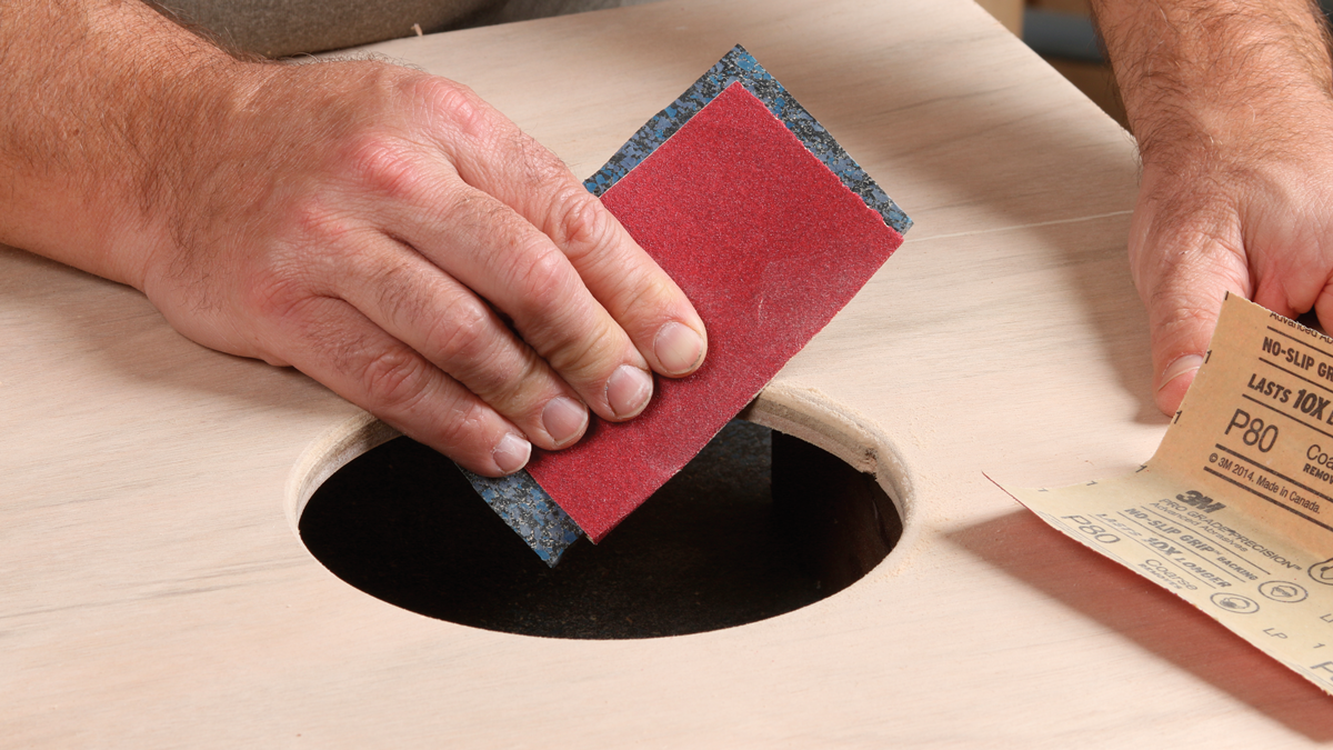 Sand it smooth. Use rough sandpaper to bevel the edge of the circle.