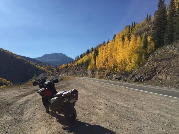 Motorcycle parked on side of scenic road