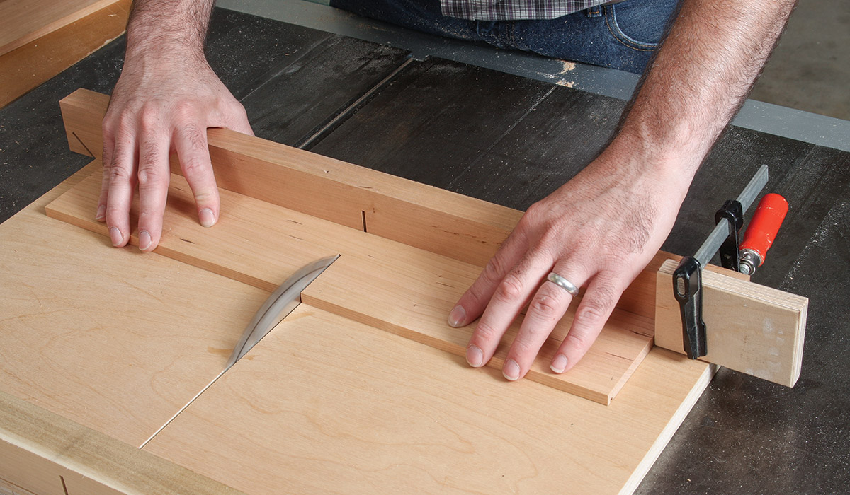 With a stop block clamped to the crosscut sled, cut the box sides to length
