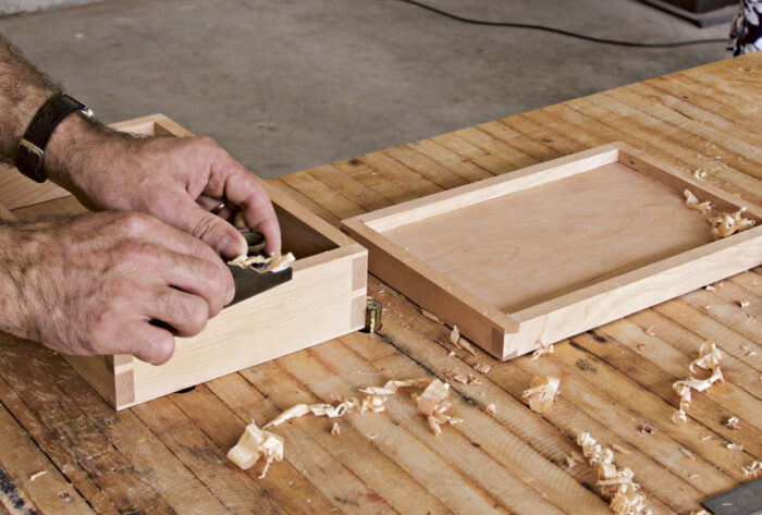 Use a block plane to smooth the inside edges of the box.