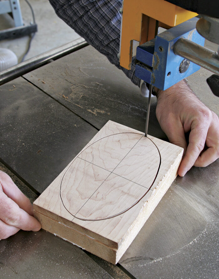 Stack the boards and saw them all at once with a thin bandsaw blade.