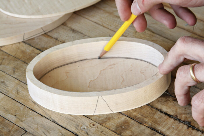 Mark the line of cut on the inner lid.