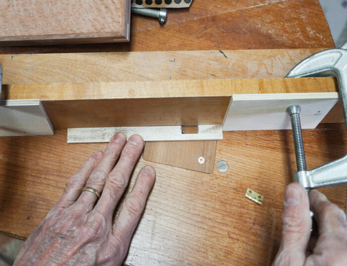 Using stop blocks on the tablesaw to control movement of the box