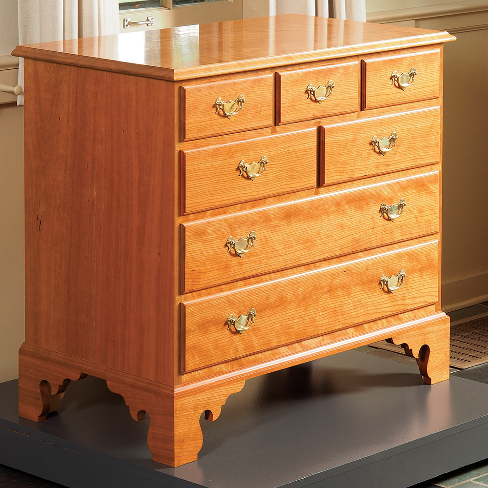 wiping varnish on chest of drawers