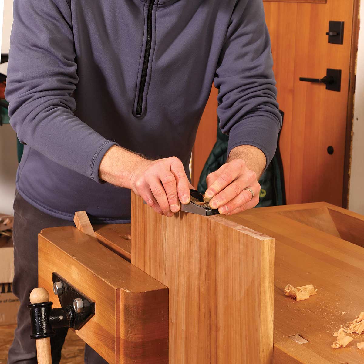 Use a vise for a wide board. When planing the end grain of wide boards like this one, Korsak fixes them in a vise.