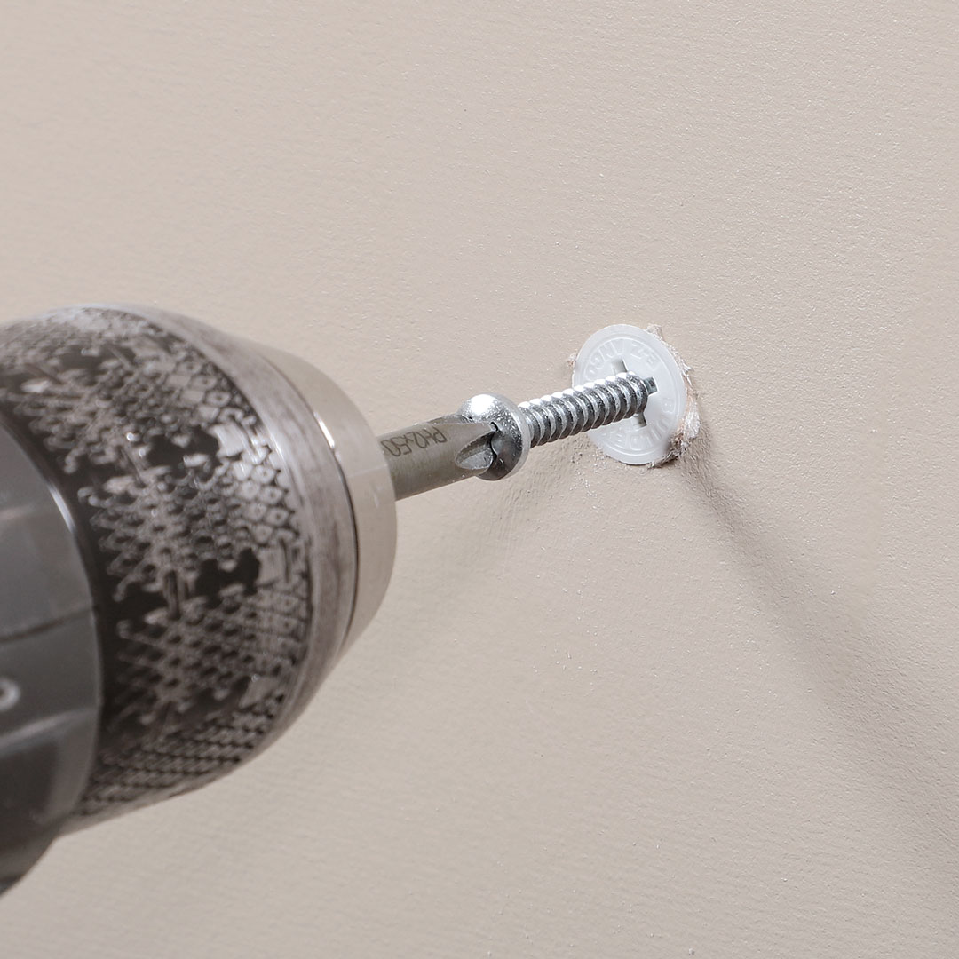 The EZ Ancor Drywall Anchor drilled into wall