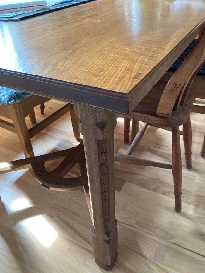 An big beefy leg of an arts and crafts style table.