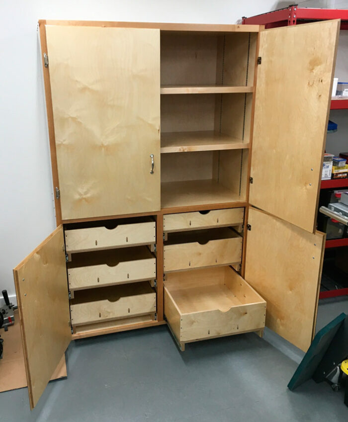 Storage cabinet. 24.5D x 48W x 74H. Made mostly from 3/4" Baltic Birch, with 1/2" Baltic Birch drawers, 1/4" back, and some solid wood for shelf support/faces and cabinet face frame.