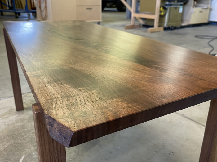 The finished product of a coffee table derived from a slab of walnut.