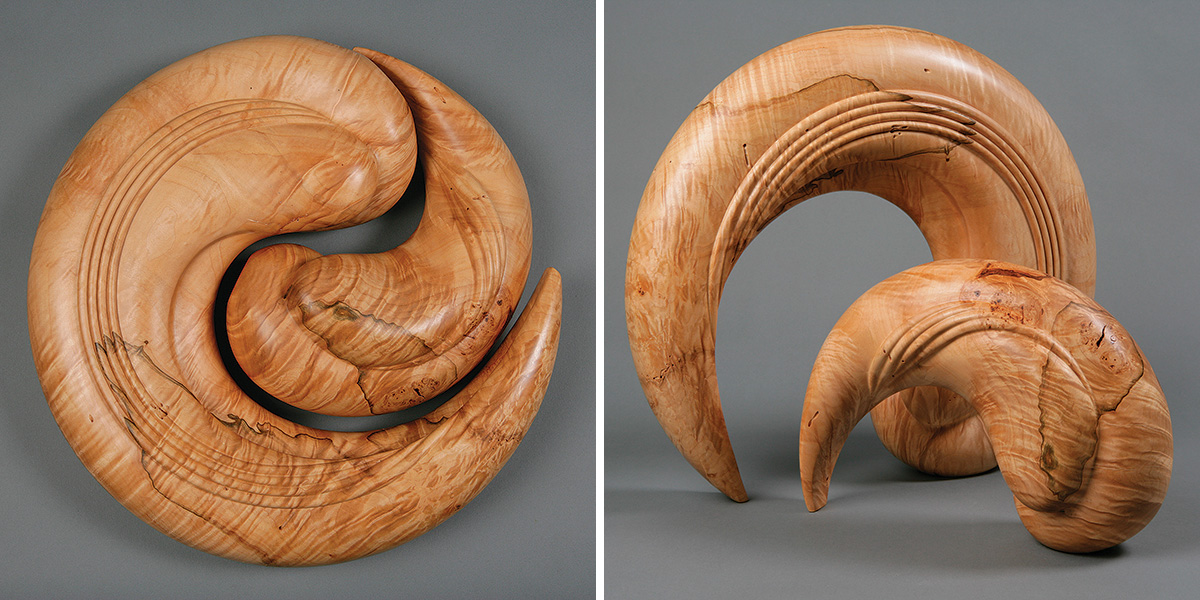 two pieces of a wood sculpture