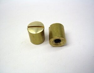 two brass barrell nuts