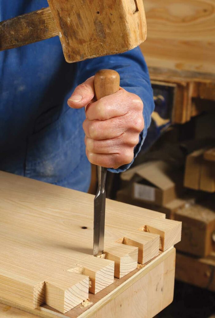 Tails on the sides. Mark the top of the sides for the tails by setting a marking gauge to slightly more than the thickness of the top. Lay out and cut the tails on the tops of each side. 