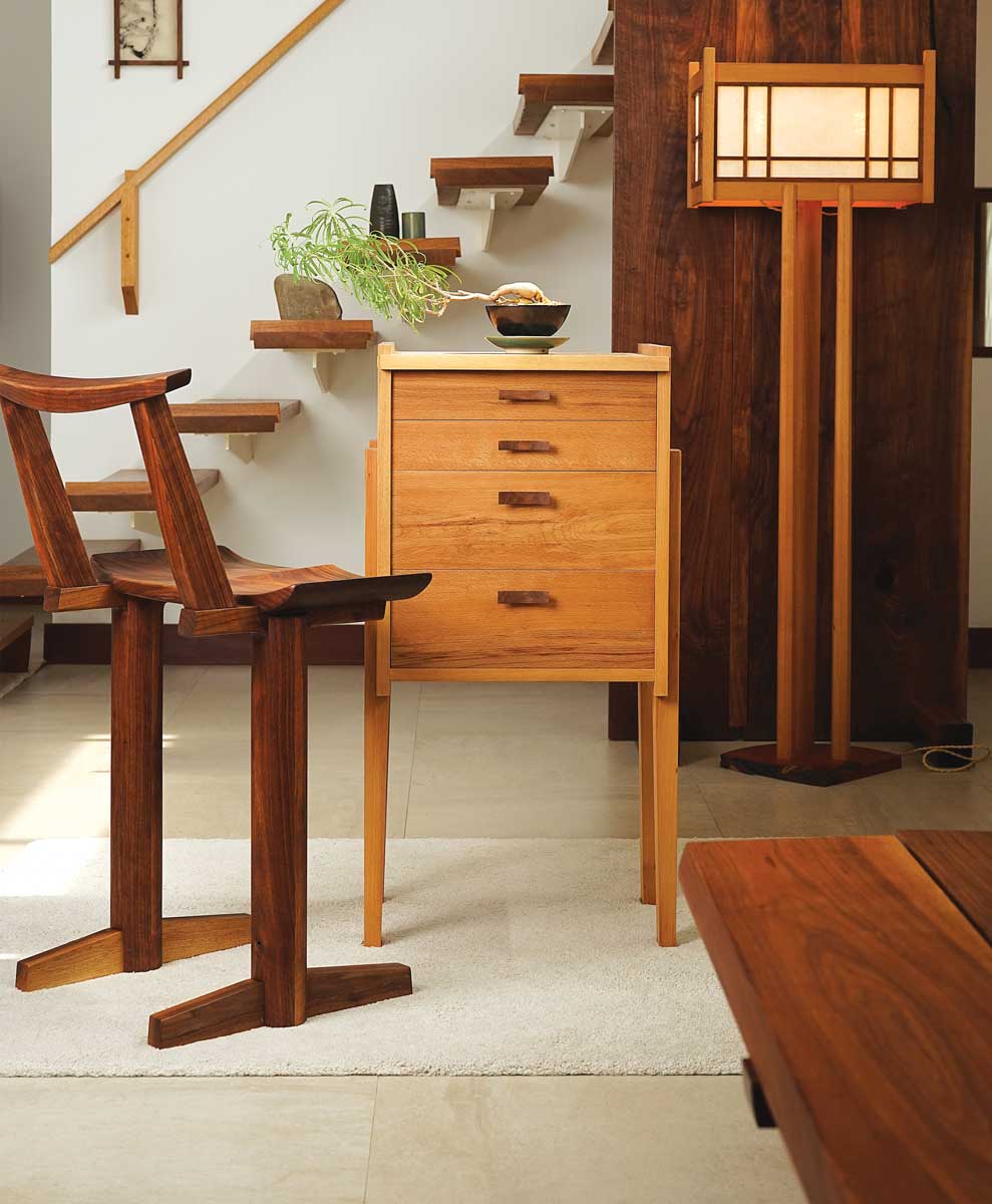 wooden chair, dresser, and lamp