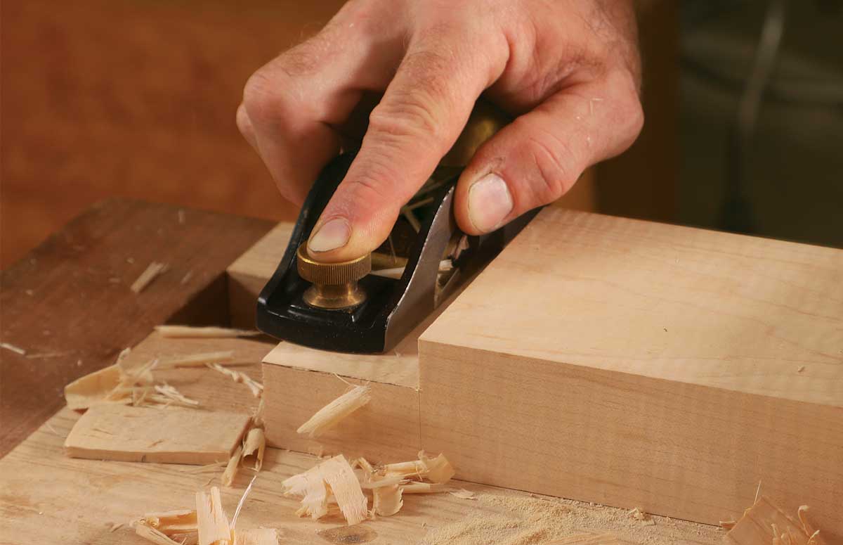 Rabbet for the rabbet. Strazza takes a few light crossgrain passes with a rabbet block plane to flatten and smooth the surface.
