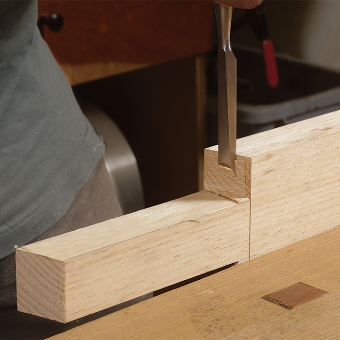Chiseling perfects the splat’s lower tenon shoulders