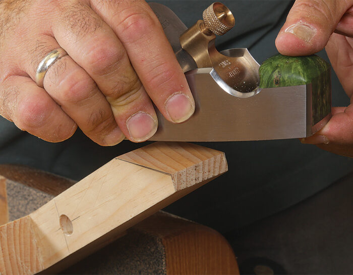 The splat's lower tenon is trimmed and angled to rest against legs
