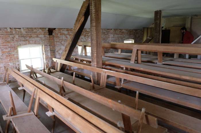 The attic of a church where extra benches are stored. The longest bench in Amana resides here. It’s 23’ long.